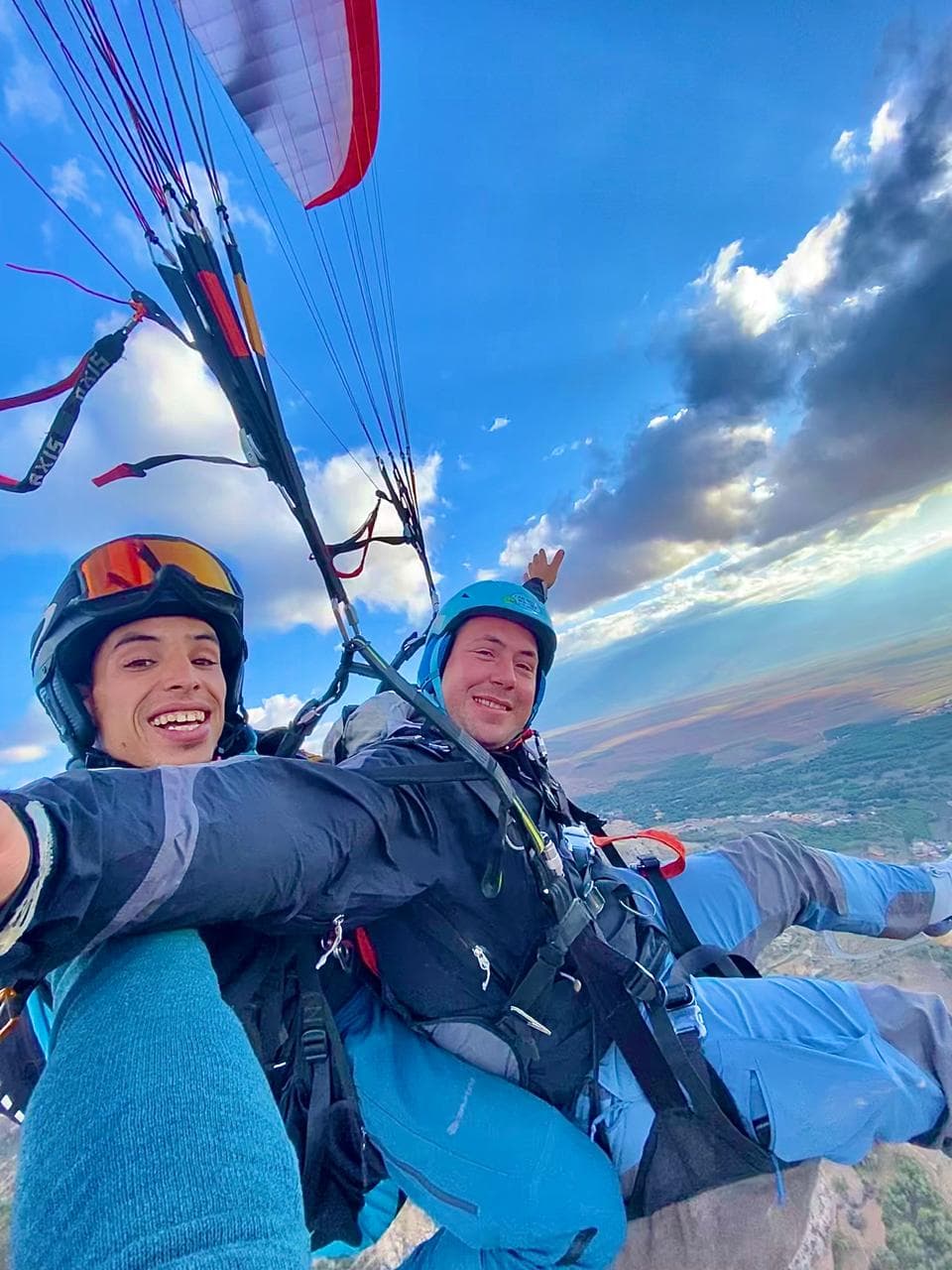 Paragliding pilot and traveler preparing for launch in the Atlas Mountains.