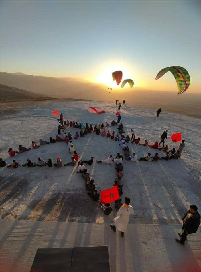 Tandem paragliding flight over the Atlas Mountain foothills in Morocco.